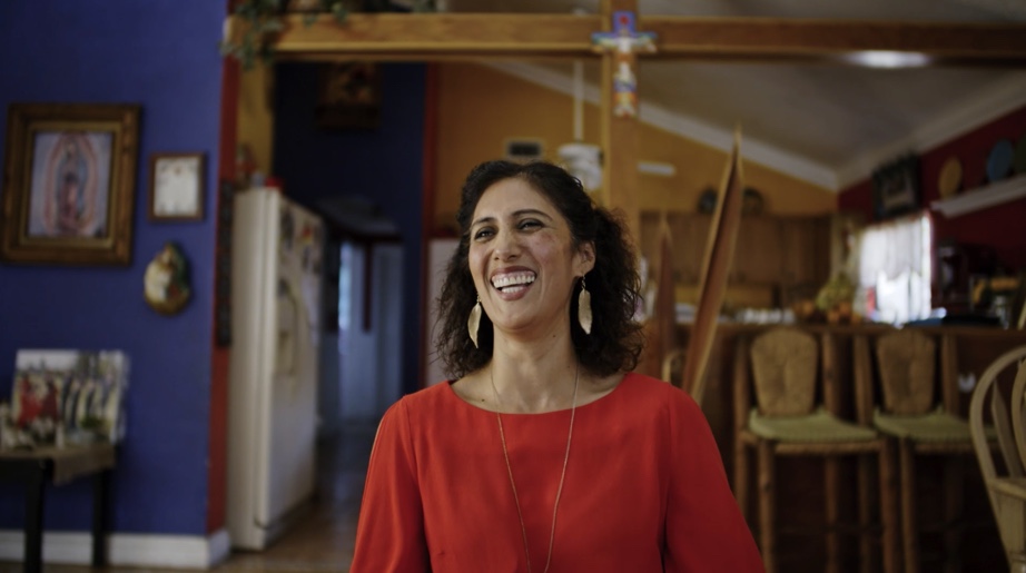 Norma Vazquez smiling during interview